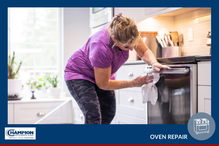 Woman cleans the front of an oven as part of oven maintenance