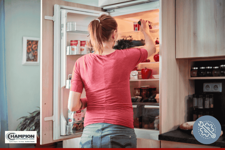 woman in front of an open refrigerator